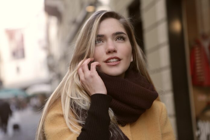 Woman in Brown Coat and Brown Scarf